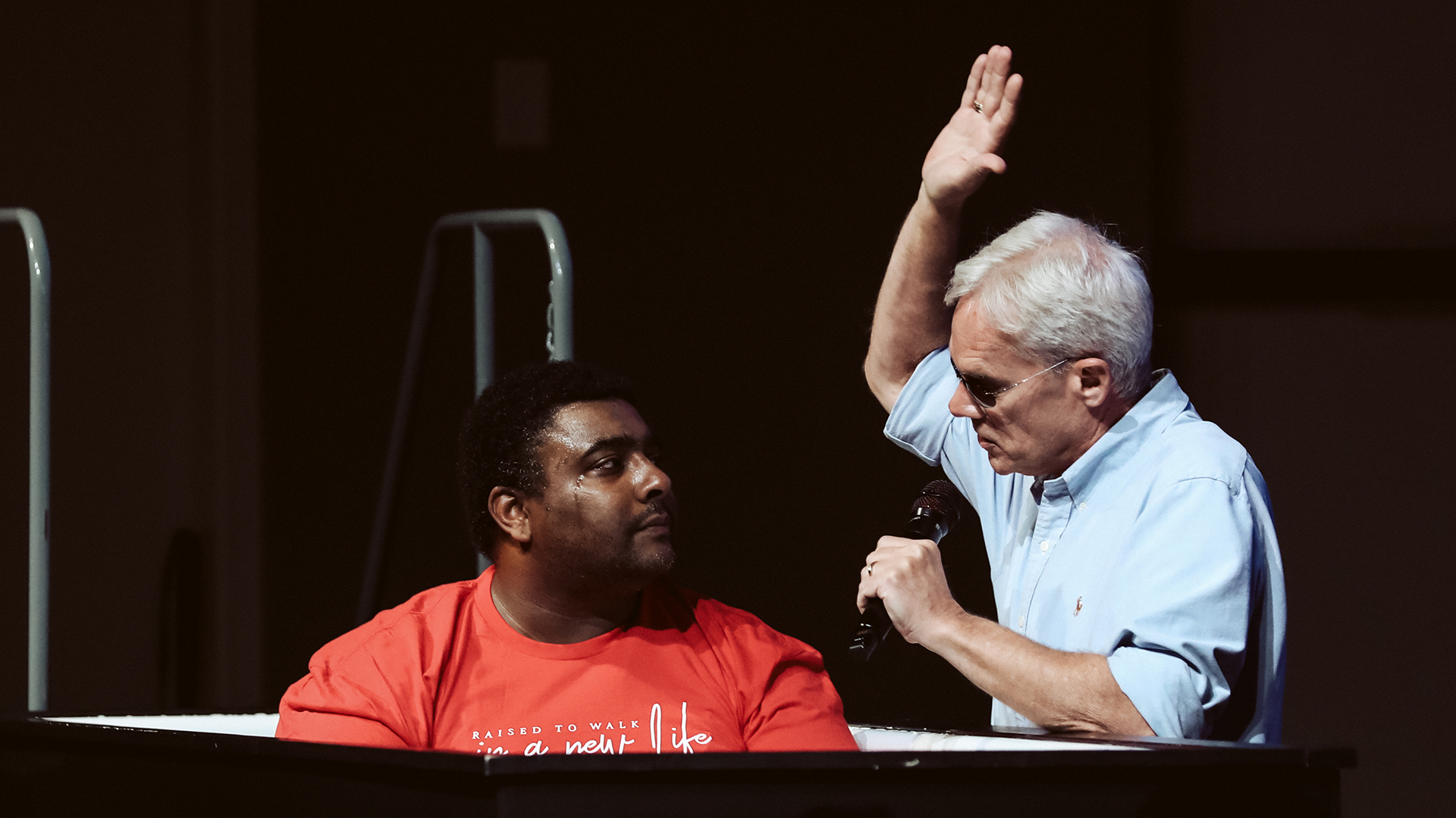 Steve Morgan baptizes during a Sunday service